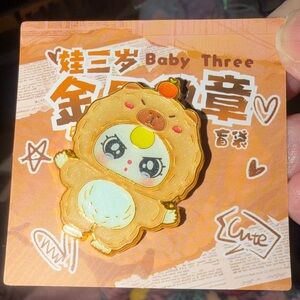Baby Three Badge of Metal Series pin, produced by POP MART.